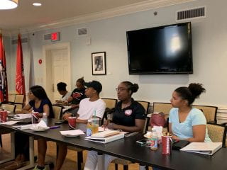 BSA and BASS Student Executive Team listen attentively at retreat.