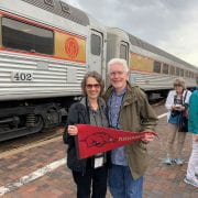 Dr. Jerry and Julie Moody showing their Arkansas spirit at the Grand Canyon Railway train station.