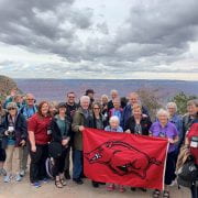 Arkansas travelers enjoying a photogenic moment at the south rim of the Grand Canyon.